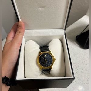 Gucci black and gold watch